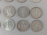 a lot of coins that are sitting on a table