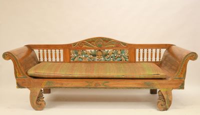 a wooden bench with a cushion on top of it