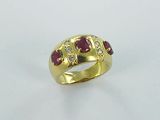 an image of a gold ring with rubies and diamonds