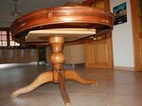 an image of a wooden table in the middle of a room