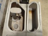 a toilet that has two separate toilets in it