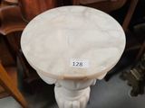a white marble table with a label on it