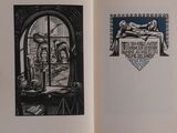 an open book with a picture of a woman laying on a bed