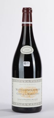 a bottle of wine that is sitting on a table