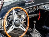 a black and white car with a wooden steering wheel