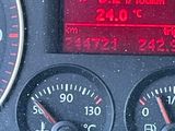 a close up of a car dashboard with a speedometer and gauges
