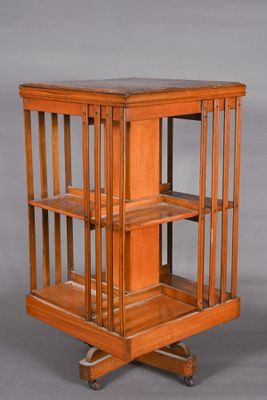 pair of antique wooden display cases with glass shelves on casteors