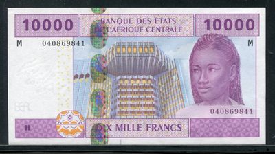 a close up of a bank note with a picture of a building in the background