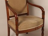 chair with striped upholstered seat and wood frame