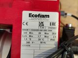 a close up of a red machine with a label on it