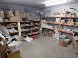 a room with a lot of boxes and boxes on the shelves