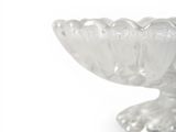 a clear glass bowl with a decorative design on it