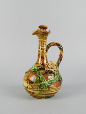 an image of a vase with a handle on a white background