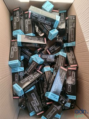 a cardboard box full of toothpaste and toothbrushes