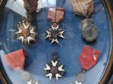 a lot of medals on display in a glass case