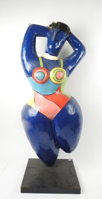 statue of a woman in a bikini with goggles on her head