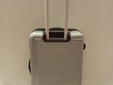 a piece of luggage that is sitting on top of a rug