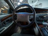dashboard of a car with a steering wheel and dashboard controls