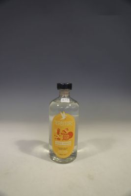a small bottle of alcohol sitting on a table