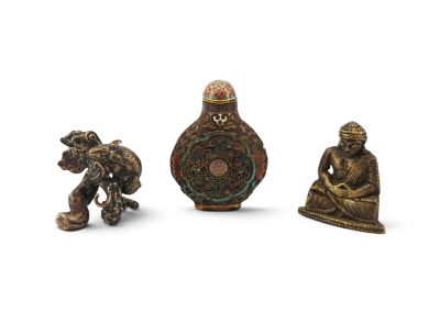 three small bronze figurines of buddhas and a dog