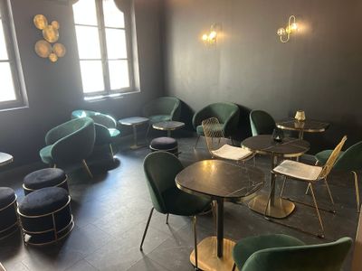 a room with a lot of chairs and tables in it