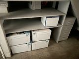 many boxes that are sitting on the shelves in the closet