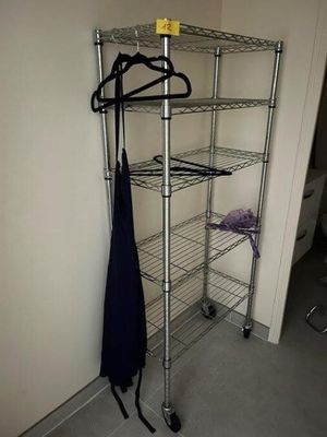 a coat rack with a coat hanger and an umbrella