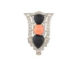 a close up of an orange and black broochle on a white background