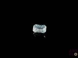 a close up of a diamond in the dark with a black background