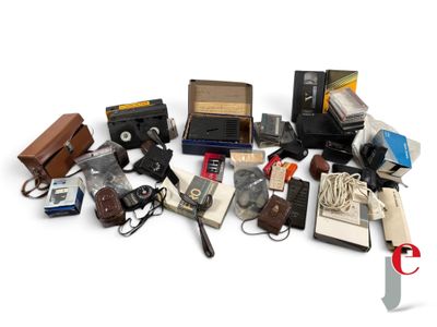 a lot of old cameras and other items on a white surface