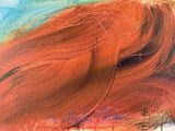une peinture abstraite représentant le visage d'une femme aux cheveux roux
