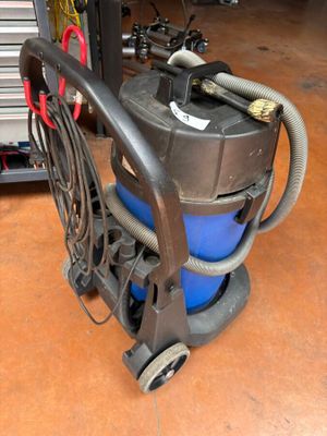 an image of a vacuum cleaner in a garage
