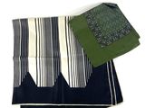 two pieces of cloth on a white table cloth