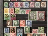 a black framed picture of a collection of stamps on display