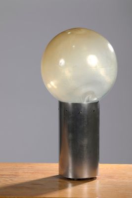 an image of a lamp that is sitting on a wooden table