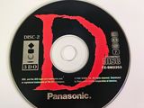 a disc with the letter d on it sitting on a table
