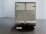 a truck that is parked in a large room