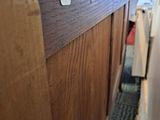 a close up of a bed with a wooden headboard