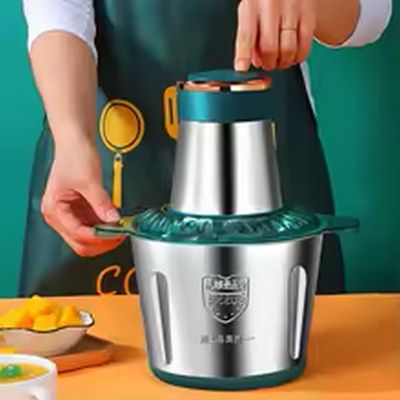 a woman that is making something with a blender