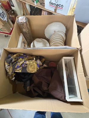 a cardboard box full of items in a room