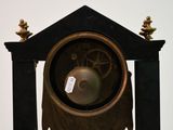 a clock that is sitting on top of a table