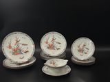 six pieces of chinese porcelain plates and saucers on a black surface