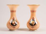 two vases with a picture of a man and a woman on them
