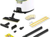 a white and black vacuum cleaner with cleaning supplies on a white background