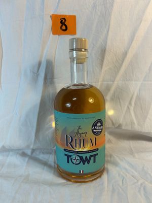 a bottle of alcohol sitting on a table with a price tag