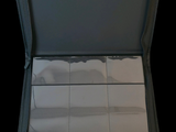 an open suitcase with a lot of papers inside of it