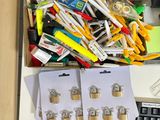 a drawer full of office supplies on a desk