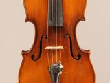 an old violin with a bow hanging from it ' s neck