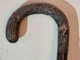 a close up of a cane on a wall