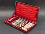 an open red case holds six bottles of wine in it